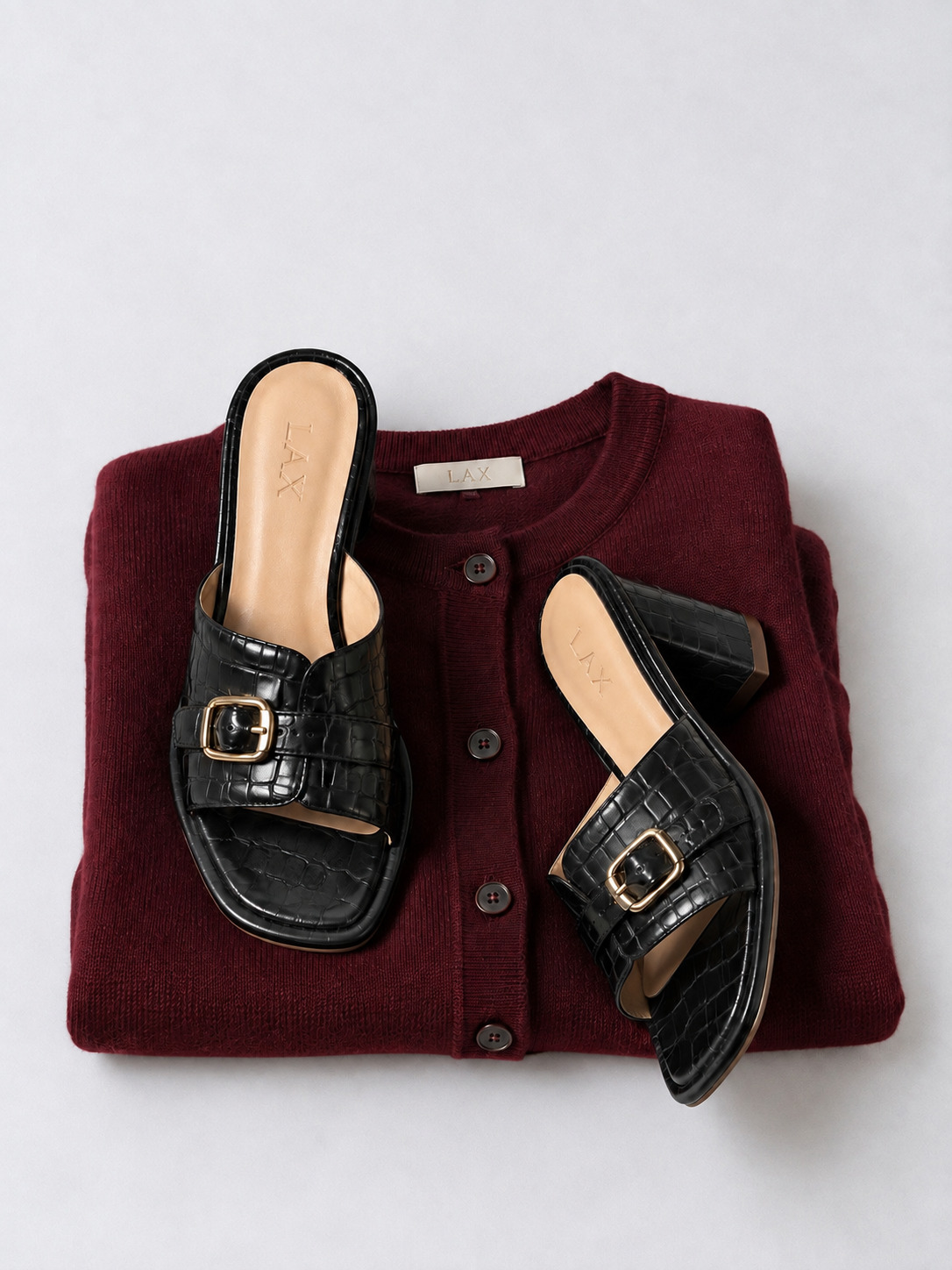 Black croc LAX mules on a burgundy cardigan