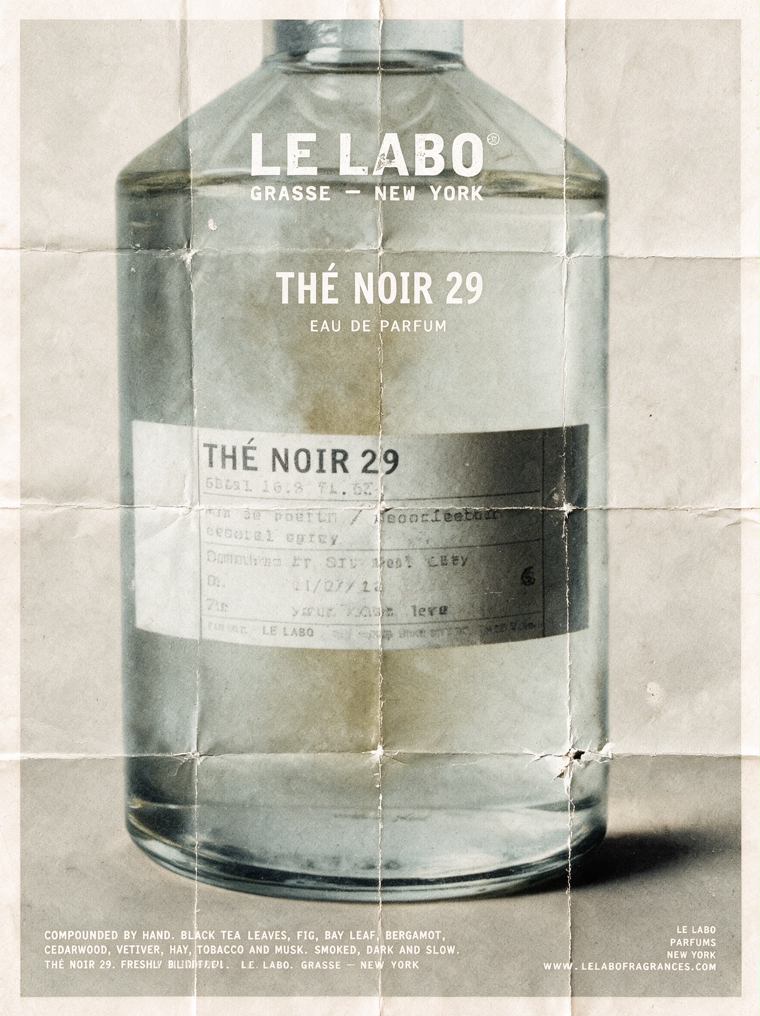 Folded poster of the Thé Noir 29 bottle