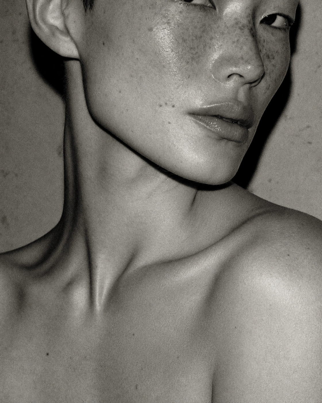Black-and-white close-up of neck and shoulder
