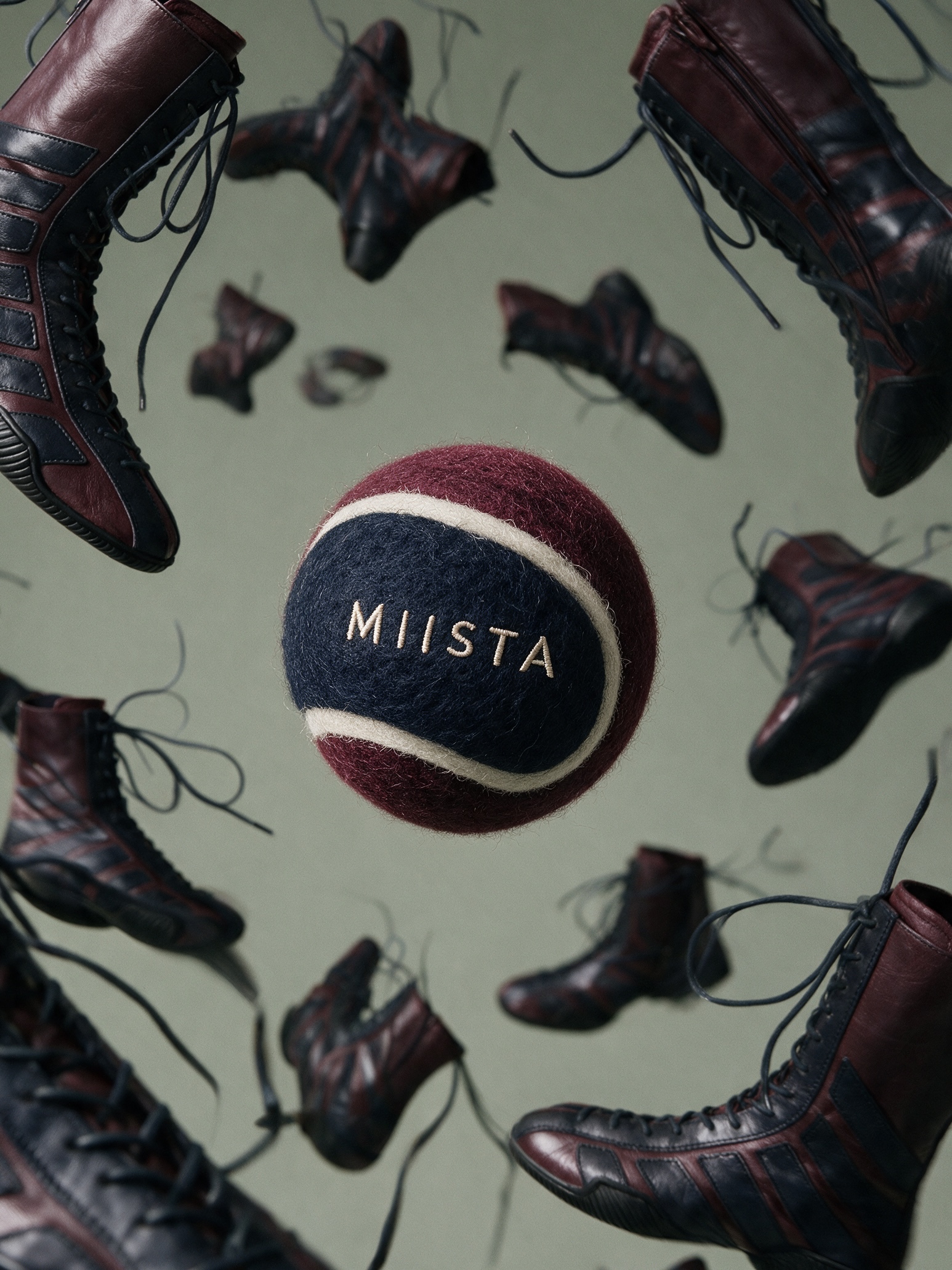 MIISTA felt tennis ball floating among flying laced boots
